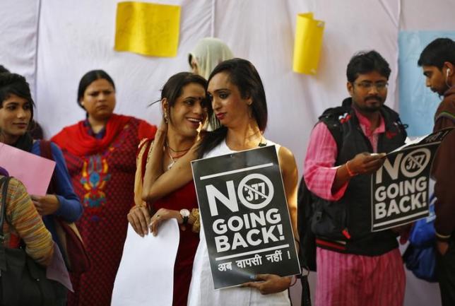 Gay rights activists hold placards during a protest in New Delhi February 11, 2014. REUTERS/Anindito Mukherjee/Files
