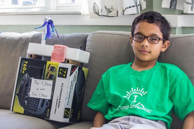 Oyon Ganguli next to a prototype of his invention, "The Cleaner." The 9-year-old Fitzgerald student won the national Mighty Minds contest with his invention. Courtesy photo.