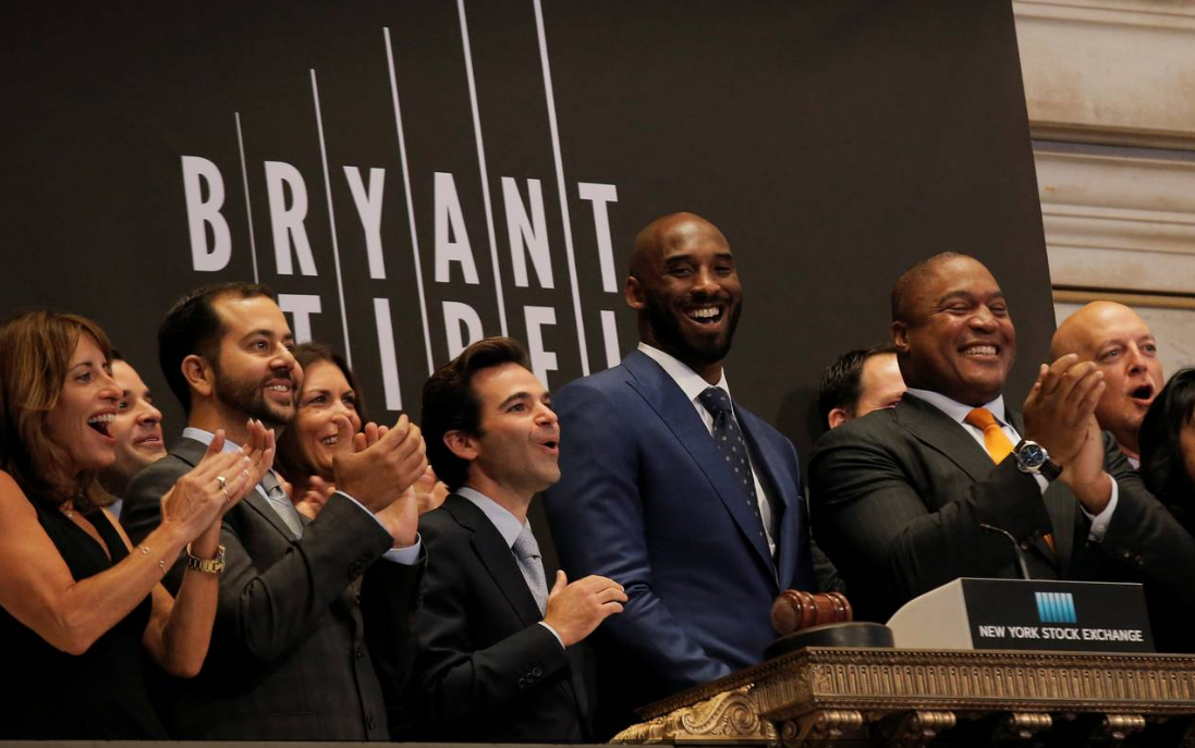 Retired NBA player Kobe Bryant rings the opening bell at the New York Stock Exchange Monday after unveiling his venture-capital fund with partner Jeff Stibel. PHOTO: BRENDAN MCDERMID/REUTERS