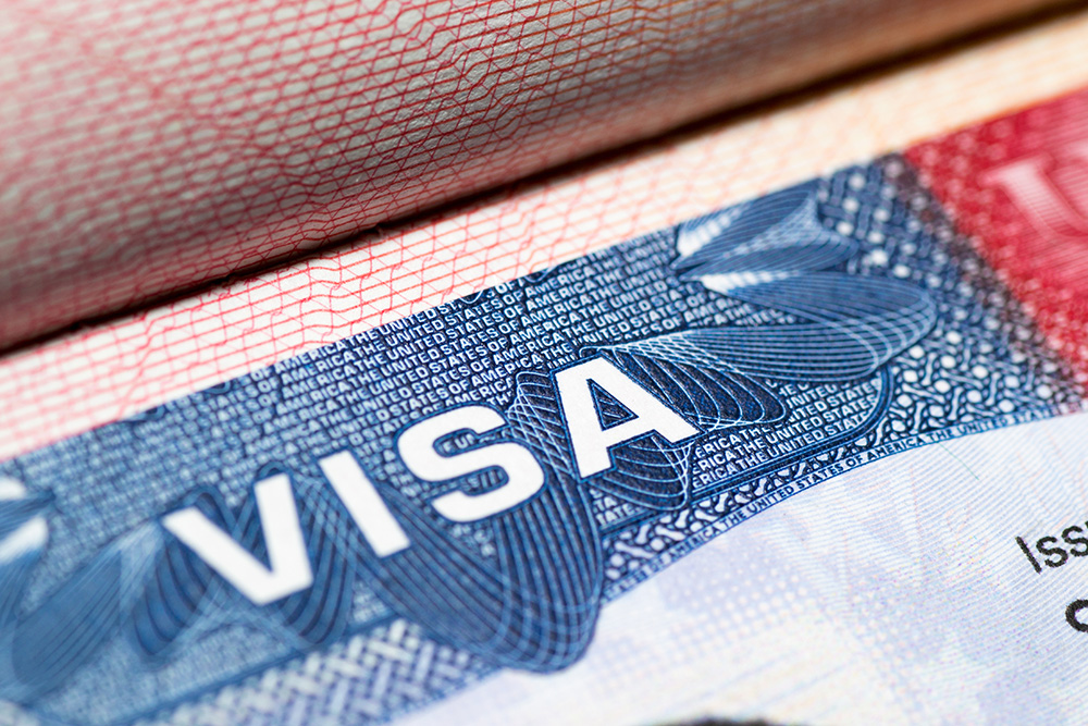 An Indian-American man and his business partner have been arrested for an alleged H-1B visa scam.