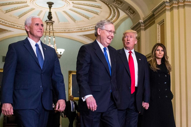From left, Vice President-elect Mike Pence, Senator Mitch McConnell, President-elect Donald J. Trump and his wife, Melania, on Capitol Hill on Thursday. Mr. McConnell has said that the Trans-Pacific Partnership would not be considered in Congress next week, signaling its demise.