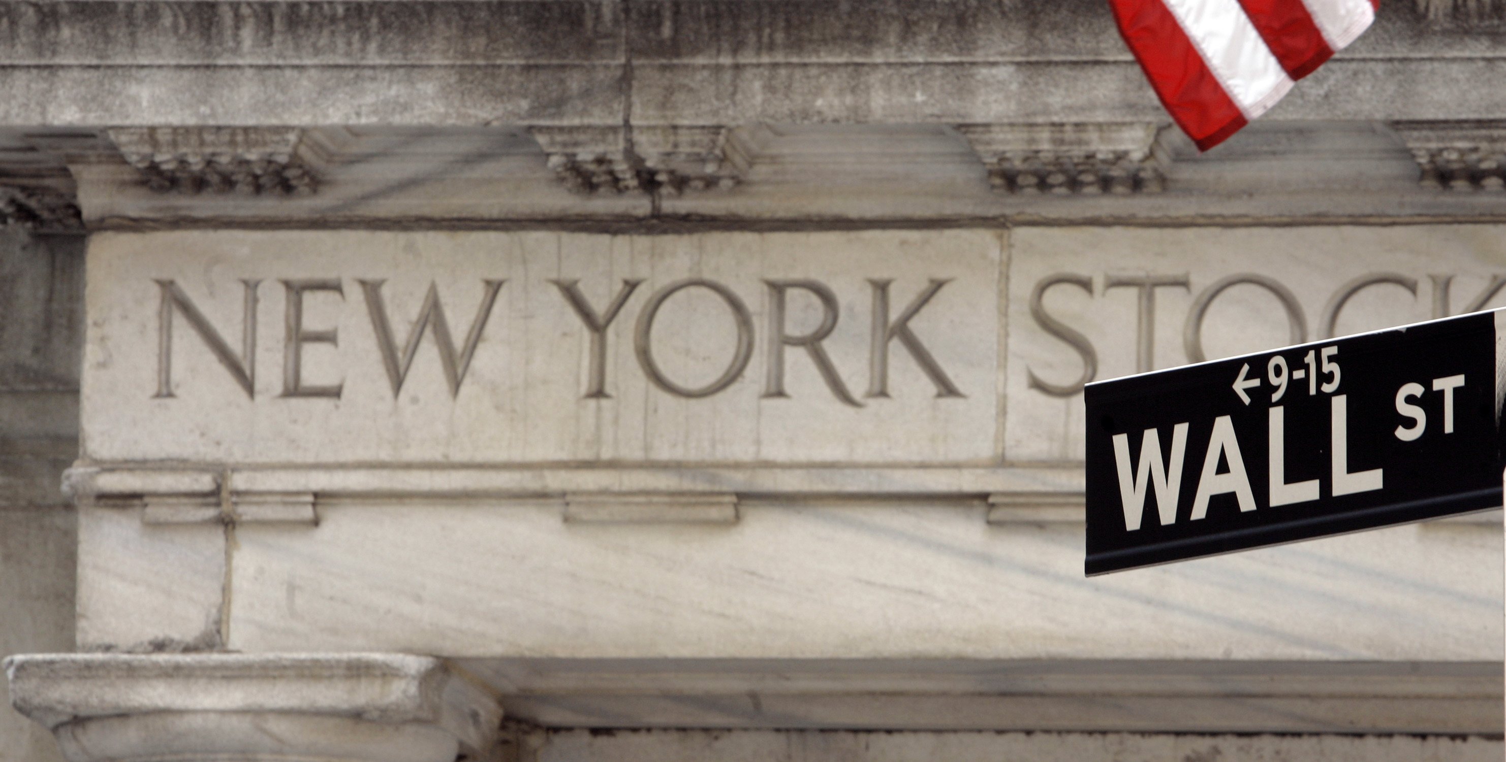A Wall Street sign is seen at an entrance to the New York Stock Exchange. (AP Photo/Richard Drew, File)