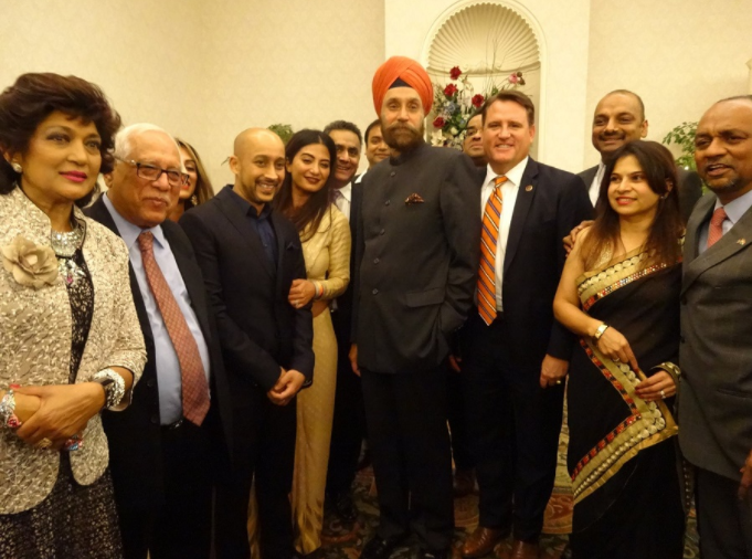 Ambassador Sarna poses for a photo with members of the Indian American community in Fairfax, VA, on Sunday.