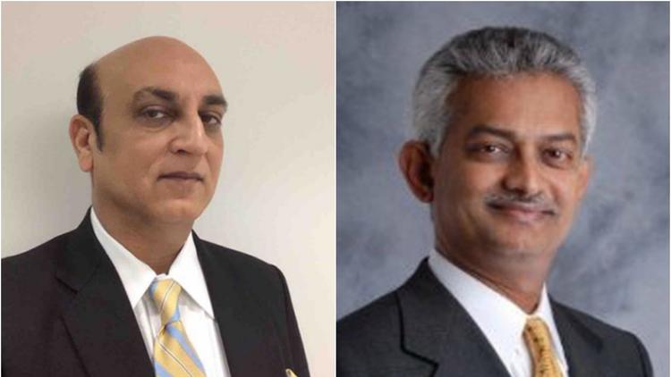 Dhru Desai, left, chief financial officer and chairman of Schaumburg-based Quadrant 4 System, and Nandu Thondavadi, CEO, were charged with wire fraud and certifying false financial reports related to two acquisitions and the settlement of a lawsuit against the company in 2013.