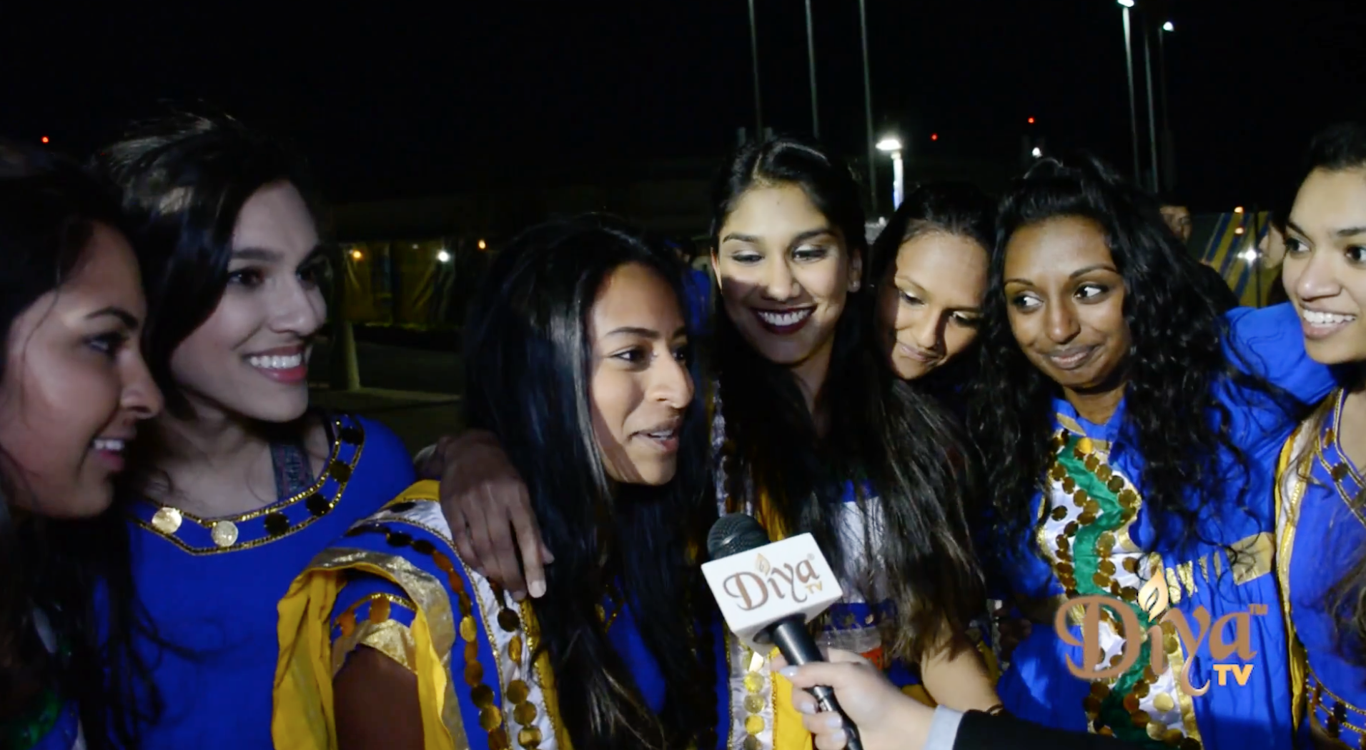 Stanford's competitive dance group Basmati Raas perform outside the Oracle Arena as fans make their way to see the NBA champs take on the Phoenix Suns