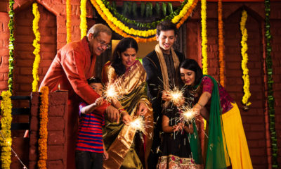 Indian Family celebrating Diwali festival with sparklers
