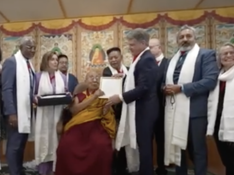 The Dalai Lama greets a US Congressional delegation visiting him in India